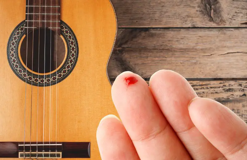 Bleeding from the cut finger by guitar